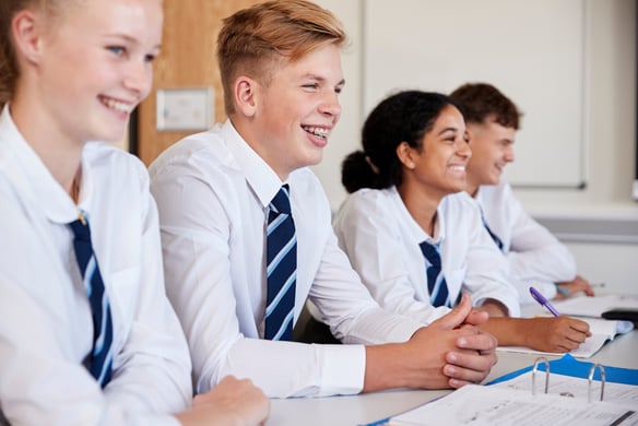 Students smiling in classroom