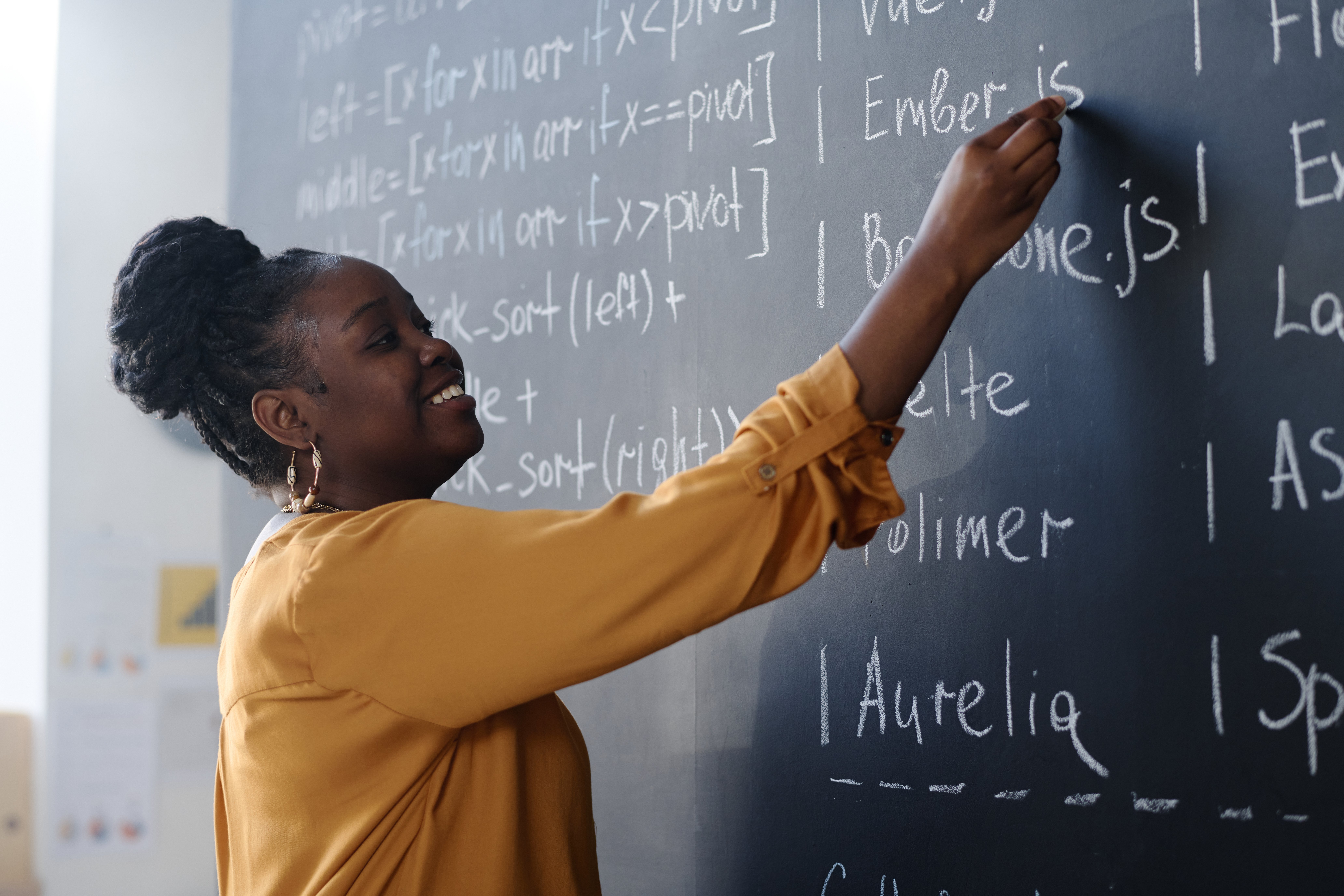 teacher-writing on-blackboard-for-class