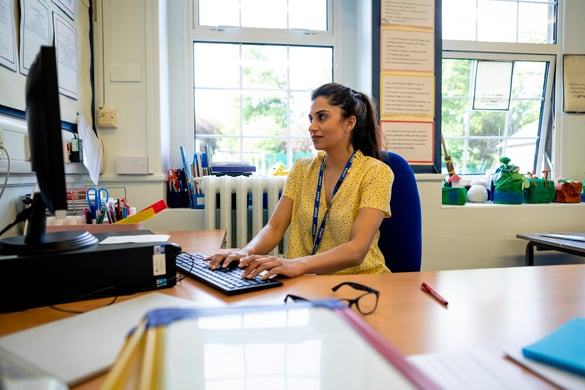 teacher working on school computer